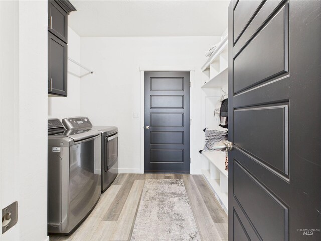 2420 Great Basin Way, Burley, ID 83318 - laundry room with cabinet space, independent washer and dryer, light wood-style floors, and baseboards