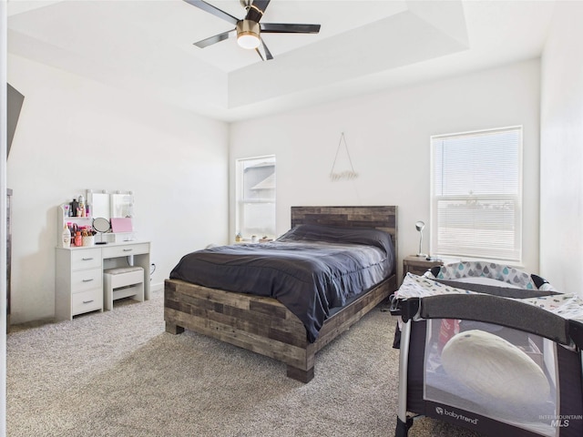 2420 Great Basin Way, Burley, ID 83318 - bedroom featuring carpet floors, ceiling fan, and a tray ceiling