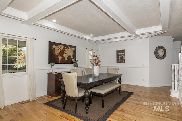 dining area with recessed lighting, baseboards, light wood-style floors, beamed ceiling, and crown molding