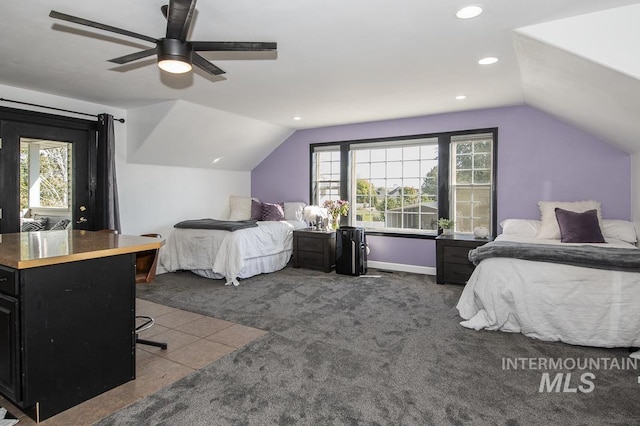 bedroom featuring vaulted ceiling, dark carpet, and recessed lighting