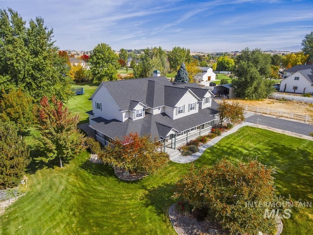 birds eye view of property with a residential view