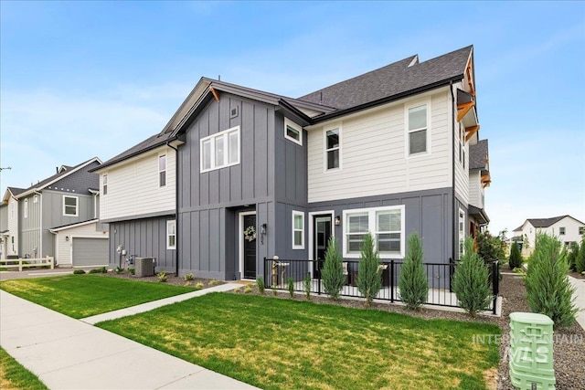 205 S Ripplerock Ln, Star, ID 83669 - view of front of property featuring board and batten siding, central air condition unit, and a front yard