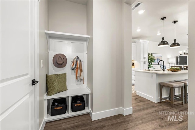205 S Ripplerock Ln, Star, ID 83669 - mudroom featuring dark wood finished floors, baseboards, a sink, and recessed lighting