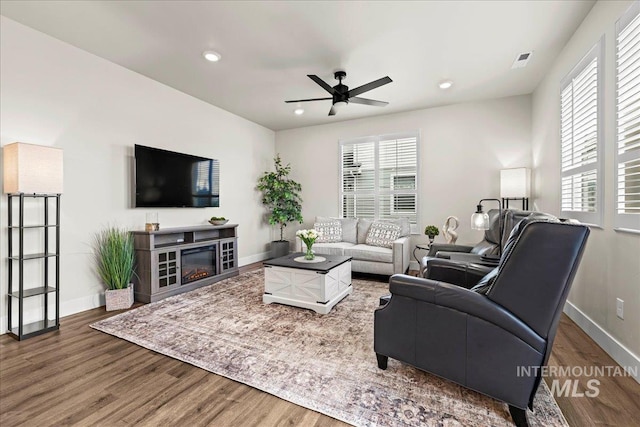 205 S Ripplerock Ln, Star, ID 83669 - living room featuring ceiling fan, wood finished floors, recessed lighting, baseboards, and a glass covered fireplace