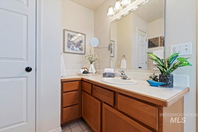 bathroom with tile patterned flooring and vanity