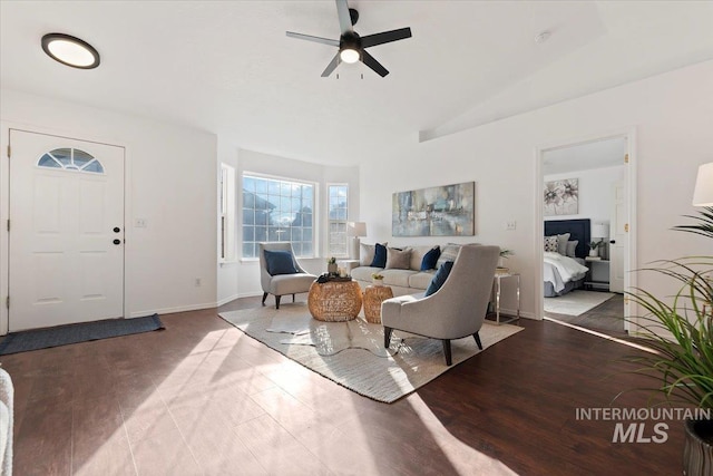 living room with light wood-type flooring, vaulted ceiling, and ceiling fan