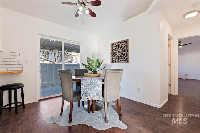 dining space featuring dark hardwood / wood-style floors and ceiling fan