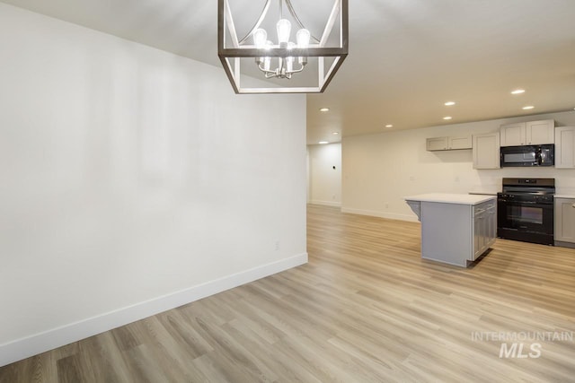 1611 Regency Way, Emmett, ID 83617 - kitchen with black appliances, gray cabinets, recessed lighting, light wood-style floors, and light countertops