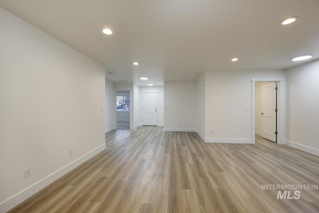 1611 Regency Way, Emmett, ID 83617 - unfurnished living room with recessed lighting and light wood-style flooring