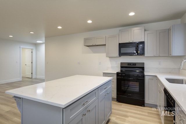 1611 Regency Way, Emmett, ID 83617 - kitchen with black appliances, gray cabinetry, light wood-style floors, and recessed lighting