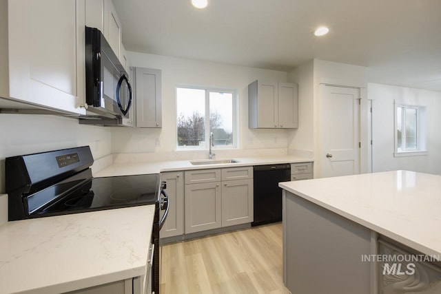 1611 Regency Way, Emmett, ID 83617 - kitchen featuring black appliances, gray cabinetry, light wood-style floors, and recessed lighting