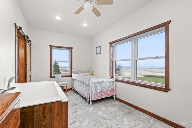 340 Gill Point Rd, Grangeville, ID 83530 - bedroom featuring multiple windows, a barn door, and ceiling fan
