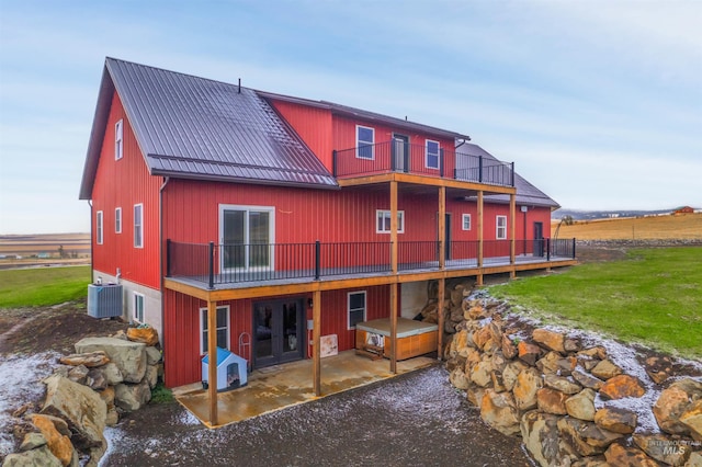 340 Gill Point Rd, Grangeville, ID 83530 - back of property with a lawn, a patio area, a balcony, and central AC unit