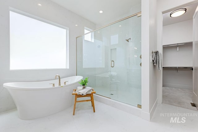 2528 S Linnet Pl, Boise, ID 83716 - full bathroom with a spacious closet, a stall shower, a freestanding bath, and marble finish floors