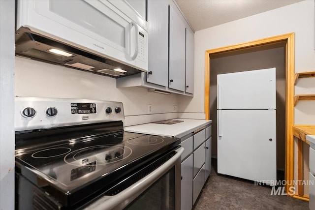 kitchen with white appliances, gray cabinetry, and light countertops