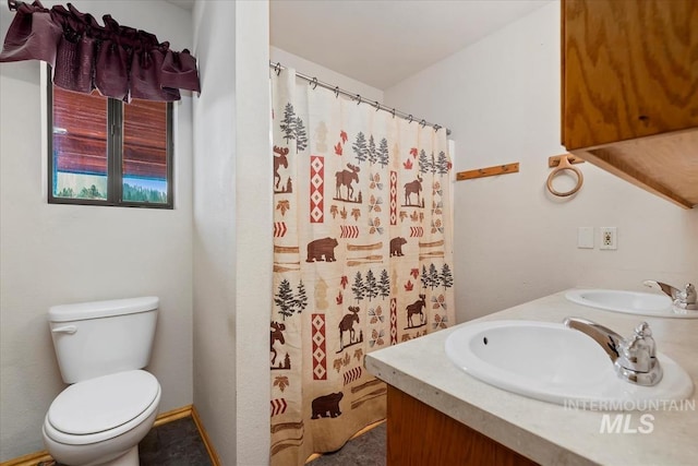 bathroom with a sink, toilet, double vanity, and a shower with shower curtain