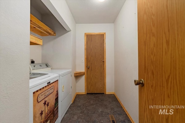 laundry room with separate washer and dryer