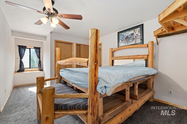 carpeted bedroom with baseboards and ceiling fan