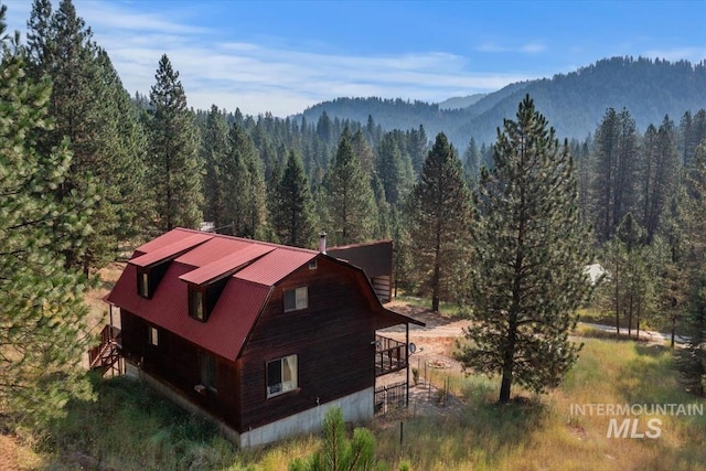 exterior space featuring a forest view