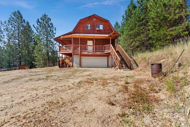 view of front facade with covered porch and a garage