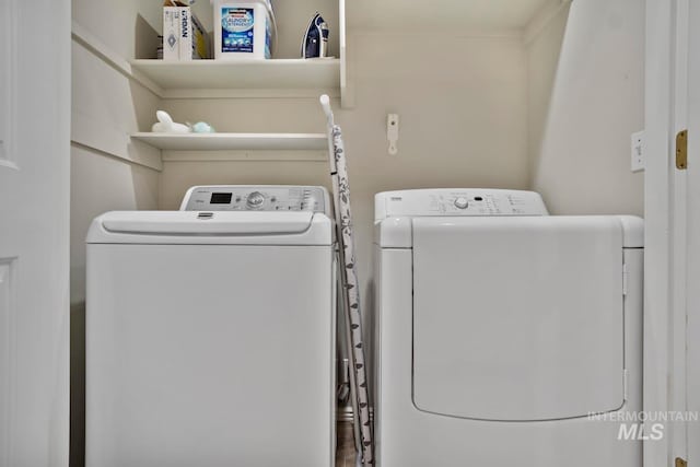 laundry area featuring washer and clothes dryer and laundry area