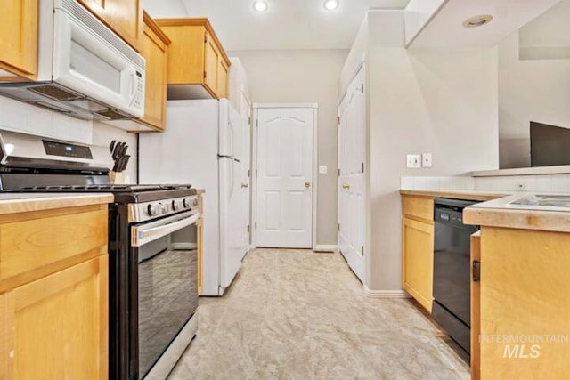 kitchen featuring recessed lighting, black dishwasher, gas stove, white microwave, and light countertops