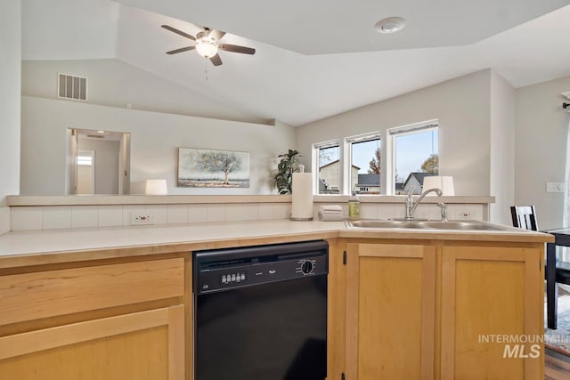 kitchen with a sink, light brown cabinets, visible vents, dishwasher, and lofted ceiling