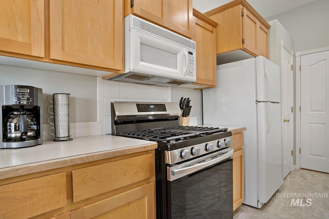 kitchen featuring white appliances, light brown cabinetry, light countertops, and backsplash