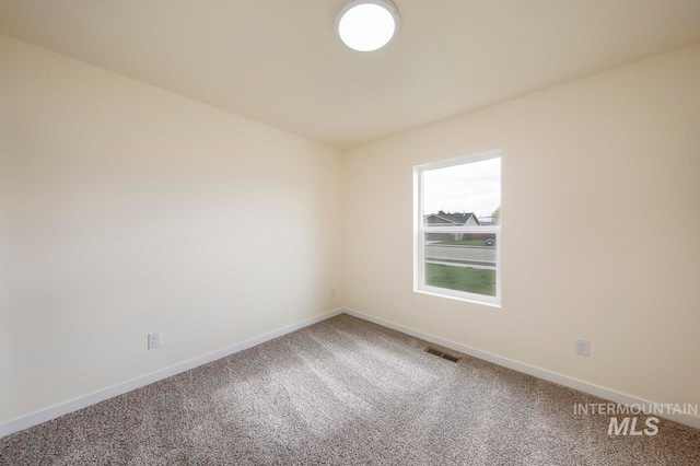 spare room featuring carpet flooring