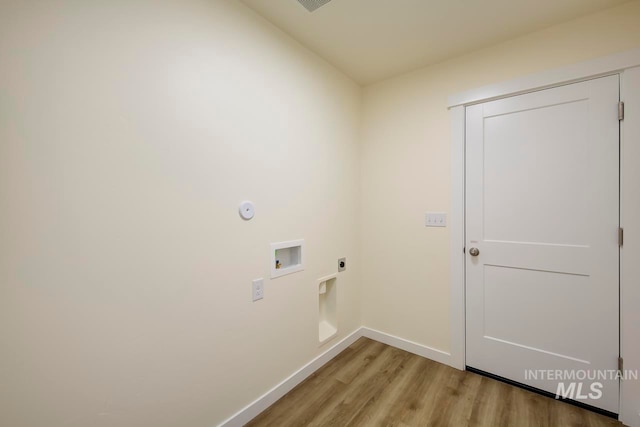 washroom featuring hookup for a washing machine, light hardwood / wood-style flooring, and hookup for an electric dryer