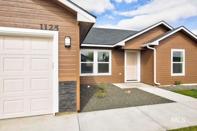 entrance to property with a garage