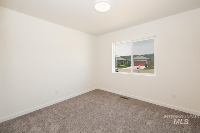 empty room featuring carpet floors