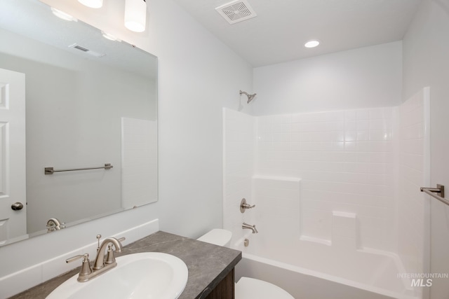 full bathroom with vanity, bathtub / shower combination, and toilet