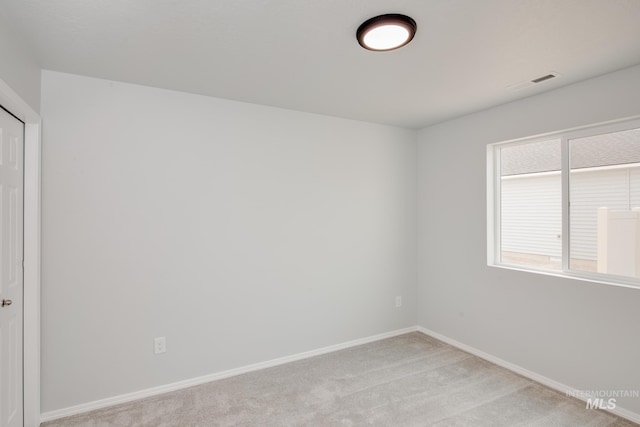 view of carpeted spare room