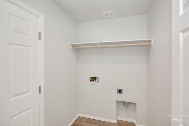 laundry area featuring washer hookup, dark hardwood / wood-style floors, and hookup for an electric dryer