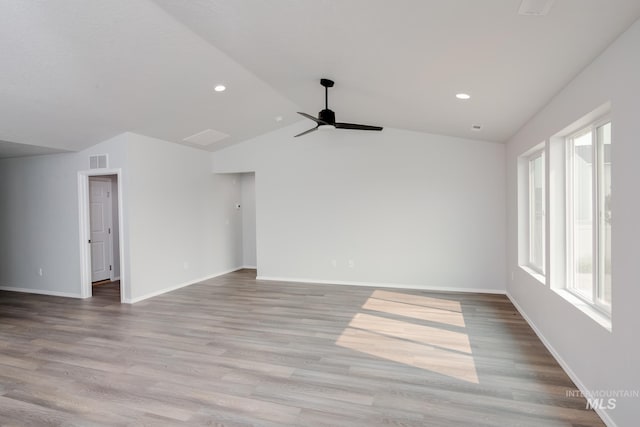 interior space with ceiling fan, light hardwood / wood-style flooring, and vaulted ceiling