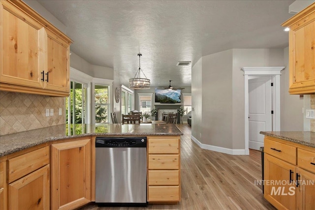 kitchen featuring stainless steel dishwasher, decorative backsplash, a peninsula, light wood-style flooring, and open floor plan