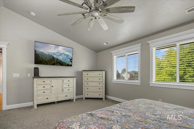 bedroom featuring lofted ceiling, carpet floors, baseboards, and a ceiling fan