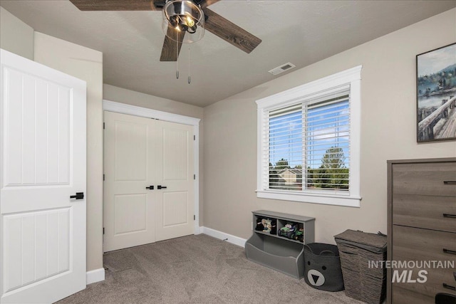 bedroom with carpet floors, baseboards, a closet, and ceiling fan
