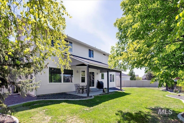 rear view of property featuring a patio