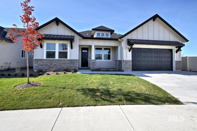 view of front of property with a garage, a standing seam roof, board and batten siding, and a front yard