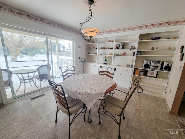 dining space featuring visible vents