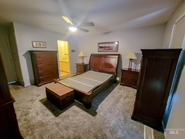 carpeted bedroom with ceiling fan and visible vents