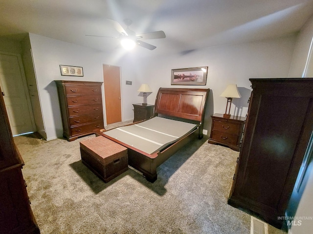 bedroom featuring light carpet and ceiling fan