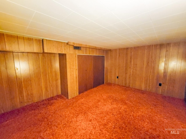 interior space featuring wooden walls