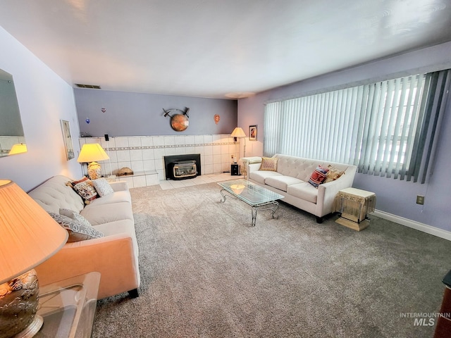 carpeted living room with visible vents and baseboards