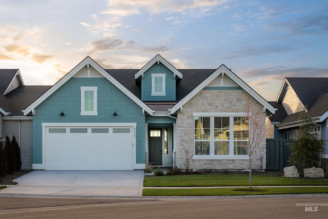 5113 S Palatino Ln, Meridian, ID 83642 - craftsman-style house with driveway, stone siding, a garage, and a standing seam roof