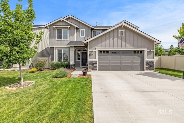 craftsman-style home featuring an attached garage, fence, concrete driveway, board and batten siding, and a front yard