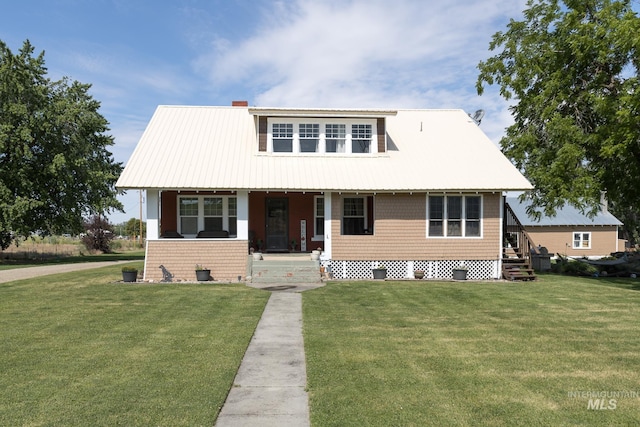 10489 Scotch Pine Rd, Payette, ID 83661 - view of front of house with covered porch and a front yard