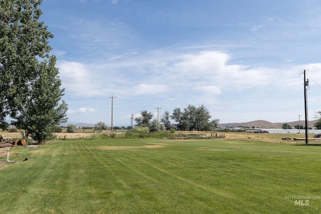 10489 Scotch Pine Rd, Payette, ID 83661 - view of green lawn featuring a mountain view
